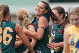 Tunisha Kikoak celebrates with Tasmania Devils teammates in a match against Western Jets at Prospect Park in 2022. Pictures by Phillip Biggs